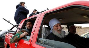 Вооруженные люди в Сирии. Фото REUTERS OMAR SANADIKI Вооруженные люди в Сирии. Фото REUTERS OMAR SANADIKI